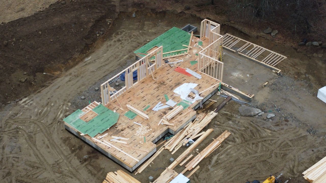 2025-03-31 - foundation with piles of lumber