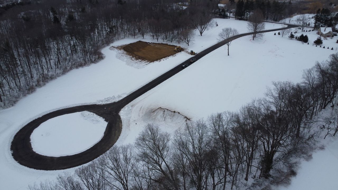 area of ground being cleared of snow and topsoil
