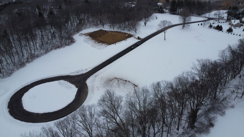 area of ground being cleared of snow and topsoil