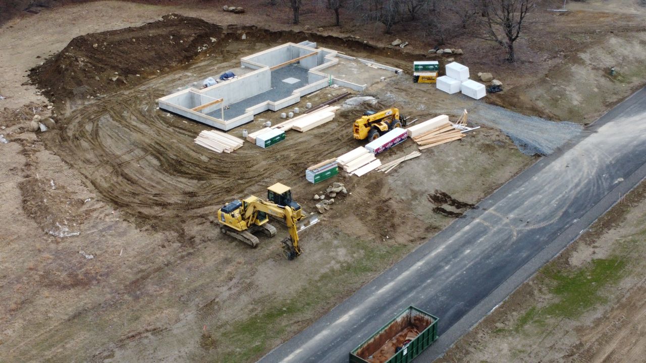 foundation with piles of lumber